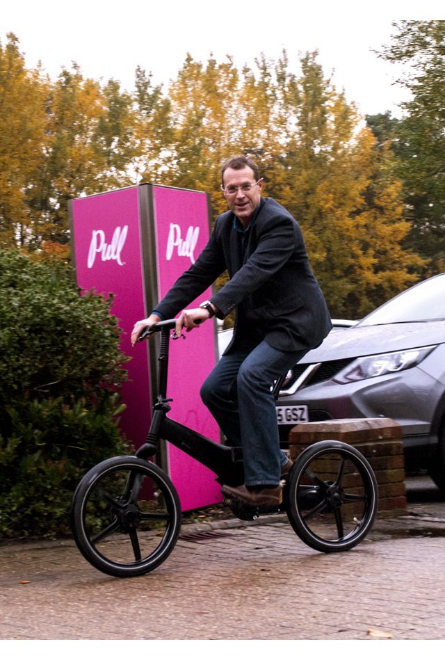 Chris Bullick outside his marketing Agency having commuted to work on his Gocycle.